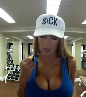 Jordan in a blue tank top, running on a treadmill